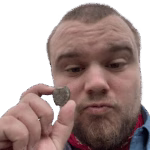 Andy Rich holding a fossil